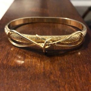 Gold bow bangle